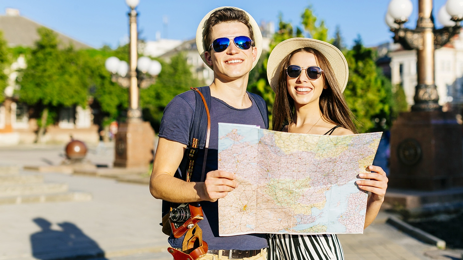 couple sightseeing with map